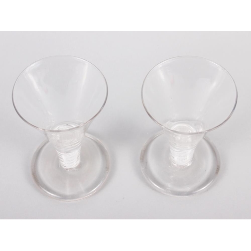 34 - A pair of cotton twist stemmed firing glasses, 4 1/2