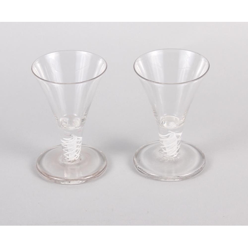 34 - A pair of cotton twist stemmed firing glasses, 4 1/2