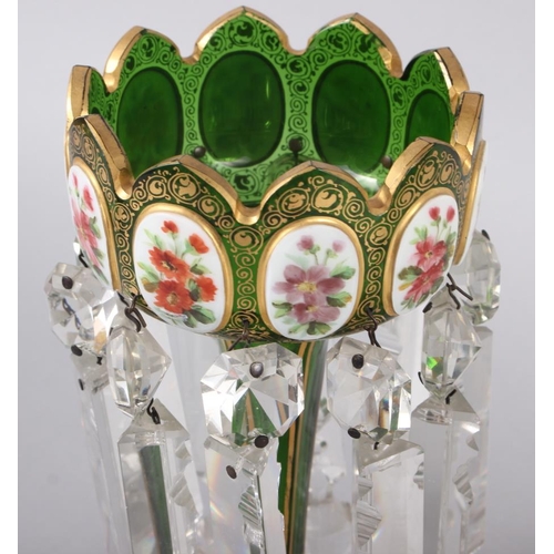 35 - A pair of green glass lustres with gilt and floral panel decoration, hung cut glass spear point drop... 