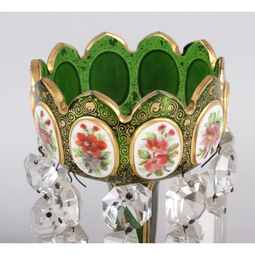 35 - A pair of green glass lustres with gilt and floral panel decoration, hung cut glass spear point drop... 