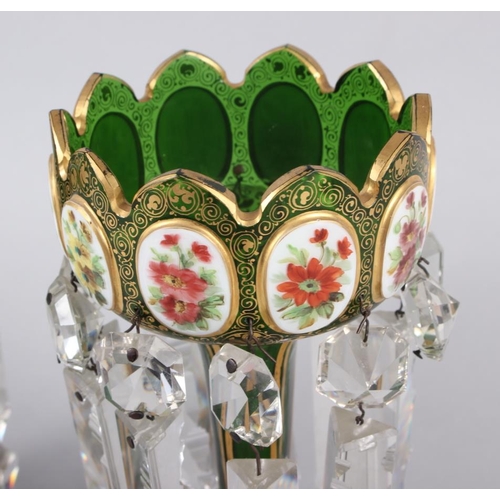 35 - A pair of green glass lustres with gilt and floral panel decoration, hung cut glass spear point drop... 