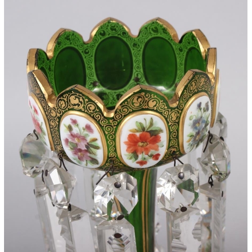 35 - A pair of green glass lustres with gilt and floral panel decoration, hung cut glass spear point drop... 