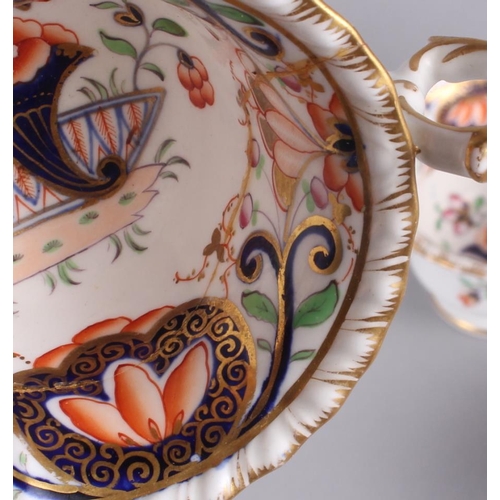 44 - A 19th century English porcelain part tea service for six, in the Imari palette with gilt highlights