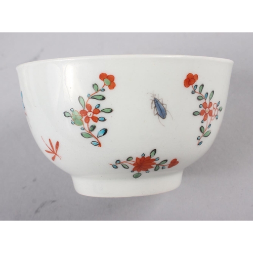 45 - An 18th century English porcelain tea bowl, decorated insects and flowers, a Ridgeway jug with flora... 