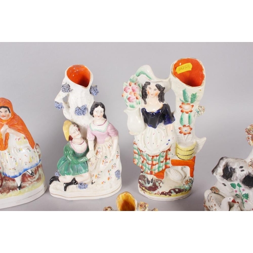 54 - Eight Staffordshire figure spill vases, including Little Red Riding Hood, 10