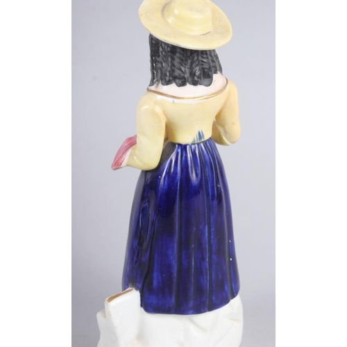 58 - A Derby figure of a woman, 10