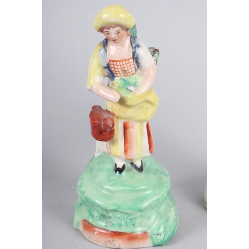 58 - A Derby figure of a woman, 10