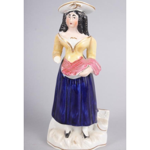 58 - A Derby figure of a woman, 10