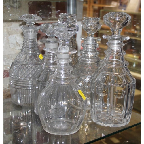 87 - A pair of 19th century ring necked decanters with four other ring necked decanters