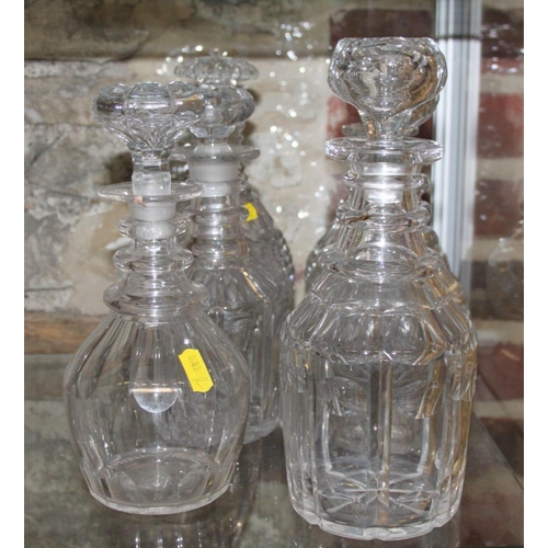 87 - A pair of 19th century ring necked decanters with four other ring necked decanters