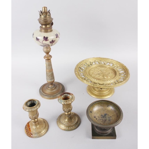 135 - A pair of brass candlesticks with acanthus leaf and scrolled decoration, 4 1/2