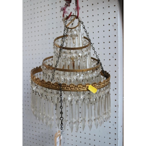 190 - A gilt metal three-tier glass drop chandelier, 9