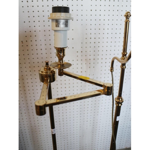 193 - A pair of gilt adjustable standard lamps, 57