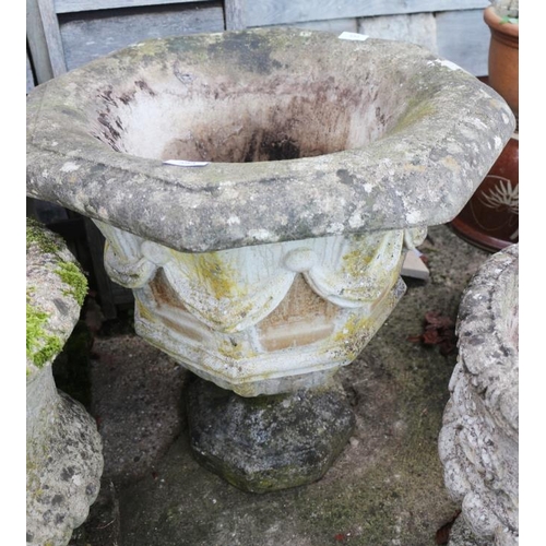 593 - An octagonal pedestal planter, decorated swags, 23