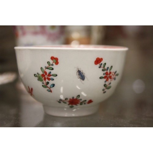 45 - An 18th century English porcelain tea bowl, decorated insects and flowers, a Ridgeway jug with flora... 