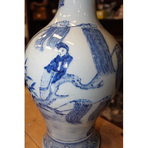 102 - A Chinese blue and white baluster vase, decorated figures in a landscape, 15 1/4