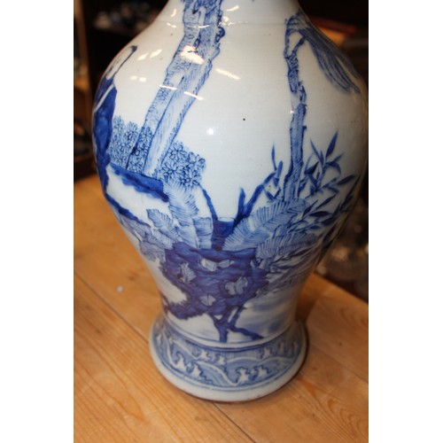 102 - A Chinese blue and white baluster vase, decorated figures in a landscape, 15 1/4