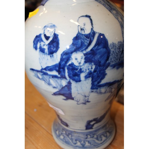 102 - A Chinese blue and white baluster vase, decorated figures in a landscape, 15 1/4