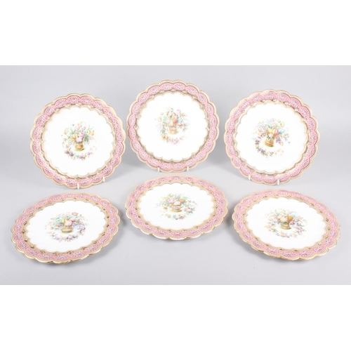 9 - Six 19th century bone china plates, decorated with baskets of flowers and fruit with pink and gilt b... 