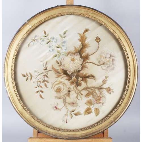 128 - A 19th century silk embroidery of flowers, 16 1/2