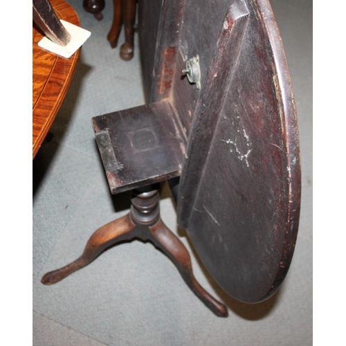 297 - A 19th century mahogany circular tilt top low occasional table, on turned column and tripod splay su... 