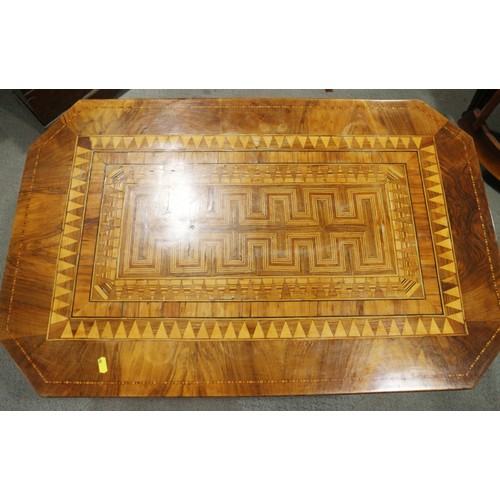 305 - A 19th century Italian walnut octagonal parquetry top low occasional table, on turned column and qua... 