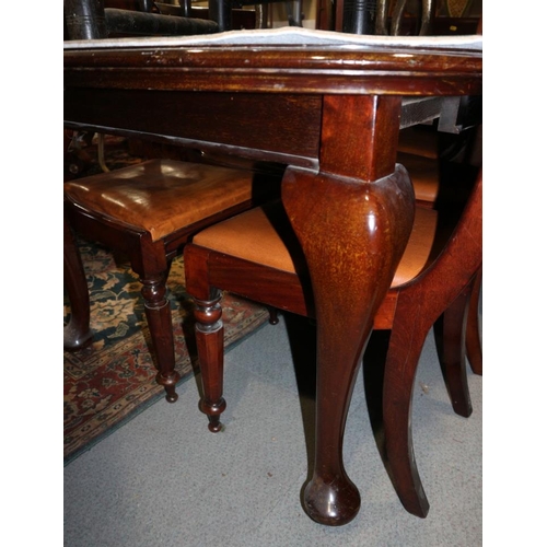 308 - A late 19th century mahogany extending dining table with one extra leaf, on cabriole supports, 58