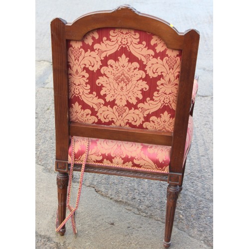 312 - A 19th century French carved walnut open armchair of Louis XVI design, upholstered in a floral broca... 