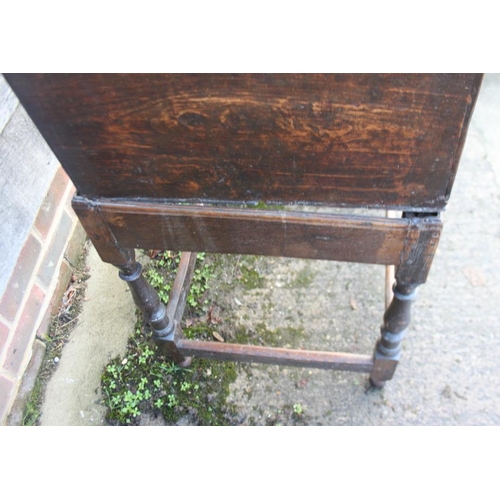 314 - A 17th century oak boarded lace box with lunette panel front, on near contemporary stand with turned... 