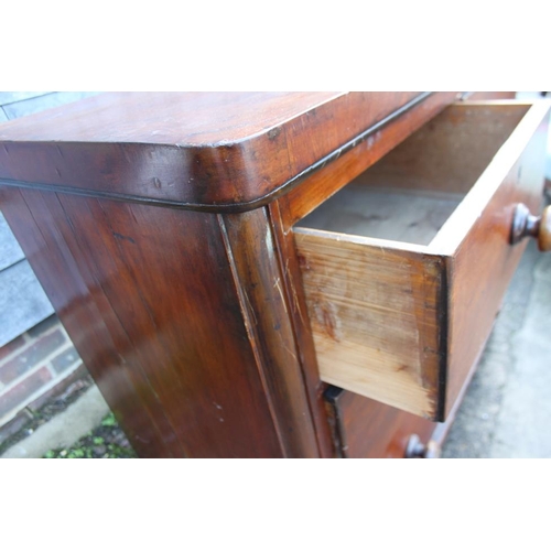 318 - A Victorian mahogany chest of two short and two long drawers, on block base, 40 1/2