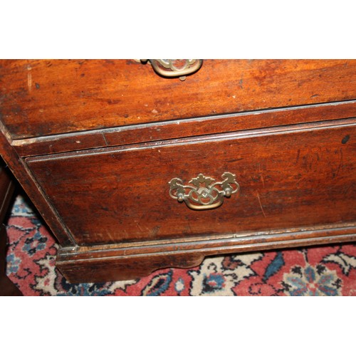 324 - A Georgian mahogany chest of two short and three long graduated drawers with pierced brass escutcheo... 