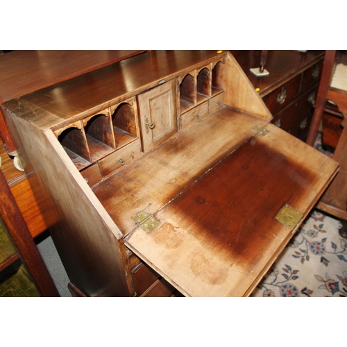 327 - A late Georgian mahogany fall front bureau with fitted interior over one long, two short and two lon... 