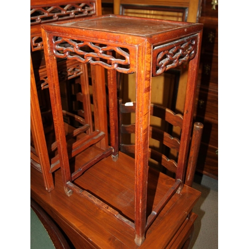 370 - A nest of three Chinese hardwood occasional tables, on moulded and stretchered supports, largest 19 ... 