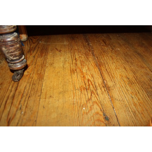 420 - A waxed pine kitchen table, on square taper supports, 71