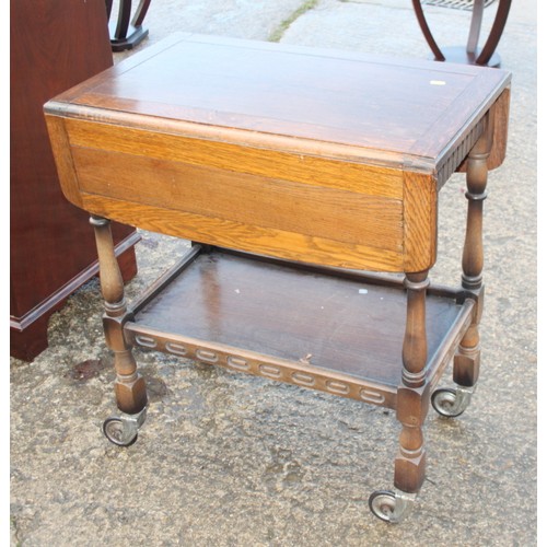 391 - An Art Deco design hardwood two-tier occasional table, 26