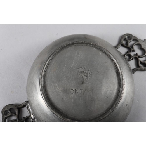 100 - A 19th century pewter tappit hen, 10 1/2