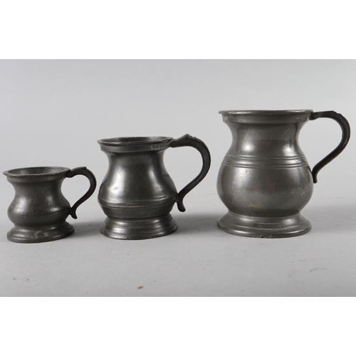 100 - A 19th century pewter tappit hen, 10 1/2