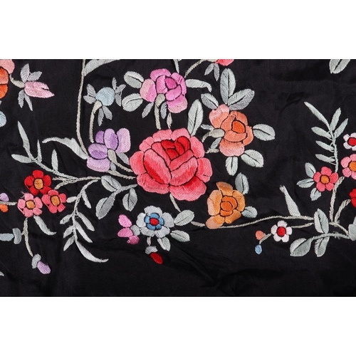 124 - A Chinese embroidered black silk piano cloth with deep fringe