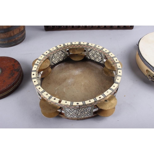 140 - Two tambourines, a wooden abacus, 14 1/2