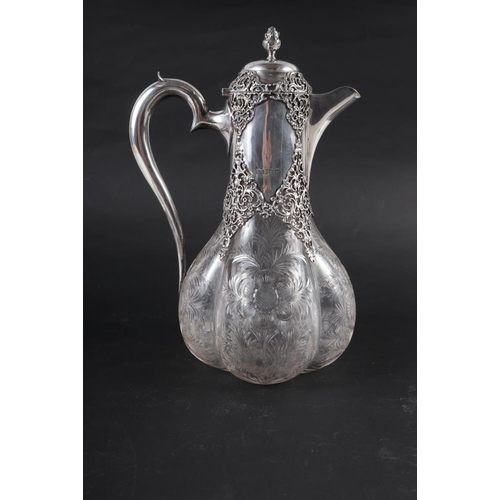 204 - A late 19th century cut glass and silver mounted claret jug, mark for William Comyns 10 1/2