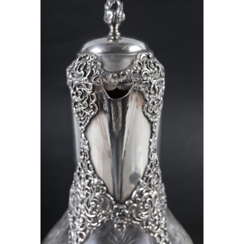 204 - A late 19th century cut glass and silver mounted claret jug, mark for William Comyns 10 1/2