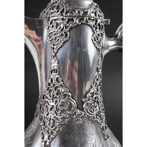 204 - A late 19th century cut glass and silver mounted claret jug, mark for William Comyns 10 1/2