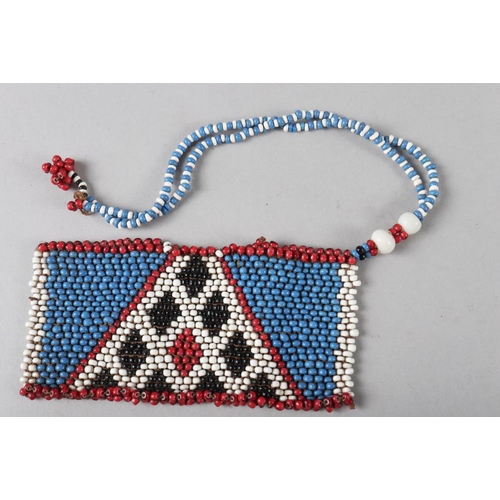 234 - A Zulu beadwork necklace, a divination box and other beadwork collected by Sir Frank Baddley, coloni... 