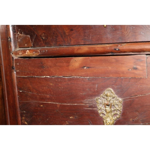 301 - An early 18th century provincial yew wood chest of two short and three long drawers with embossed br... 