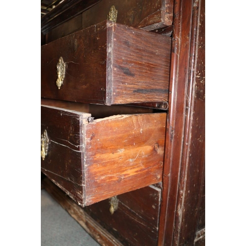 301 - An early 18th century provincial yew wood chest of two short and three long drawers with embossed br... 