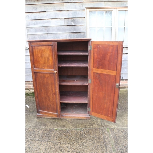 329 - A chemist's 19th century cupboard with finely adjustable shelving enclosed two panelled doors, 40