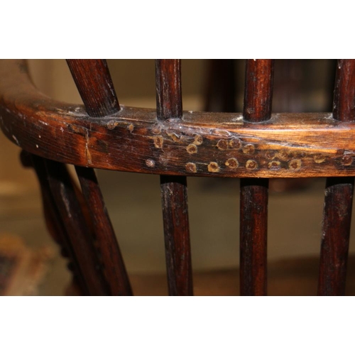 338 - An early 19th century ash and elm panel Windsor splat back elbow chair, on turned supports with crin... 