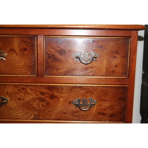 348 - A burr elm chest of two short and four long drawers, on bracket supports, 14 1/4