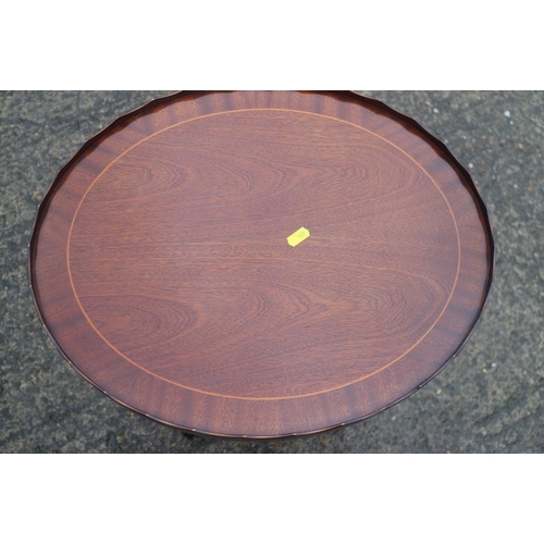 374 - A mahogany and banded oval tray top wine table, 19