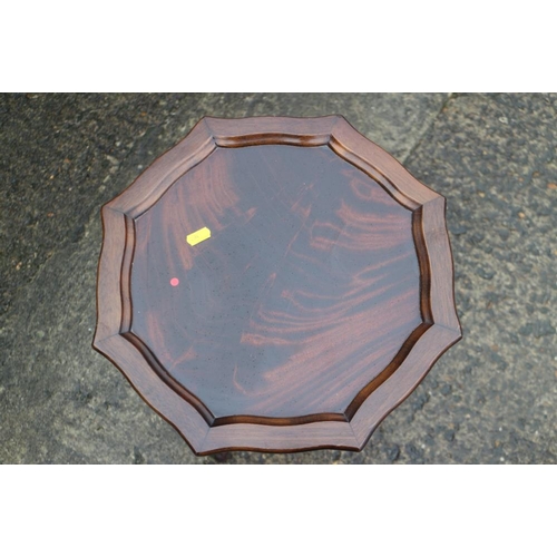 374 - A mahogany and banded oval tray top wine table, 19